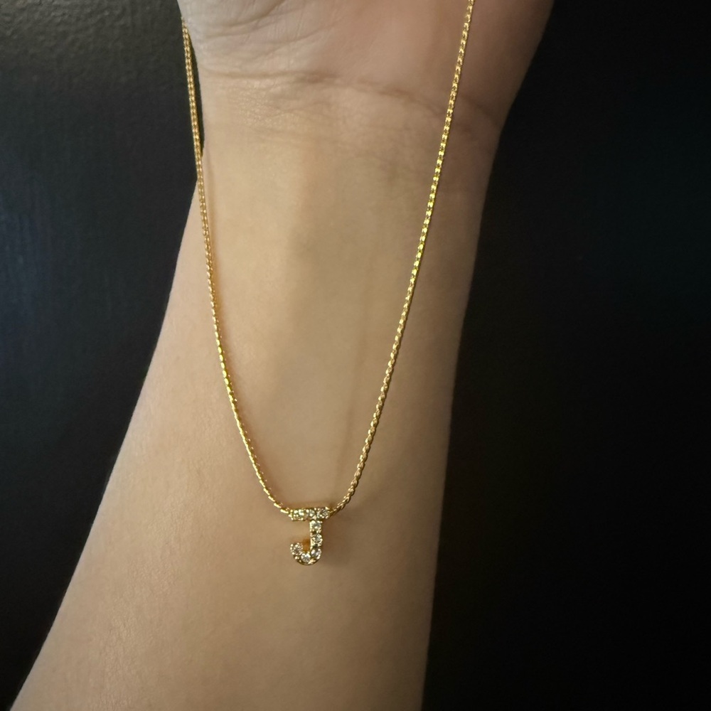 Gold tone initial necklace “J”